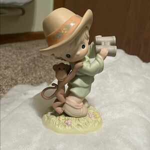 Charming Figurine with Hat and Monkey
